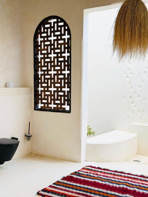 Koupelna v ubytování Tulia House Lamu