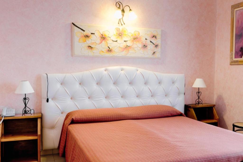 Кровать или кровати в номере Hotel Salento Gold Beach