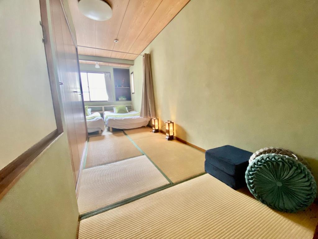 Cama ou camas em um quarto em Momodani 72 two-story detached house