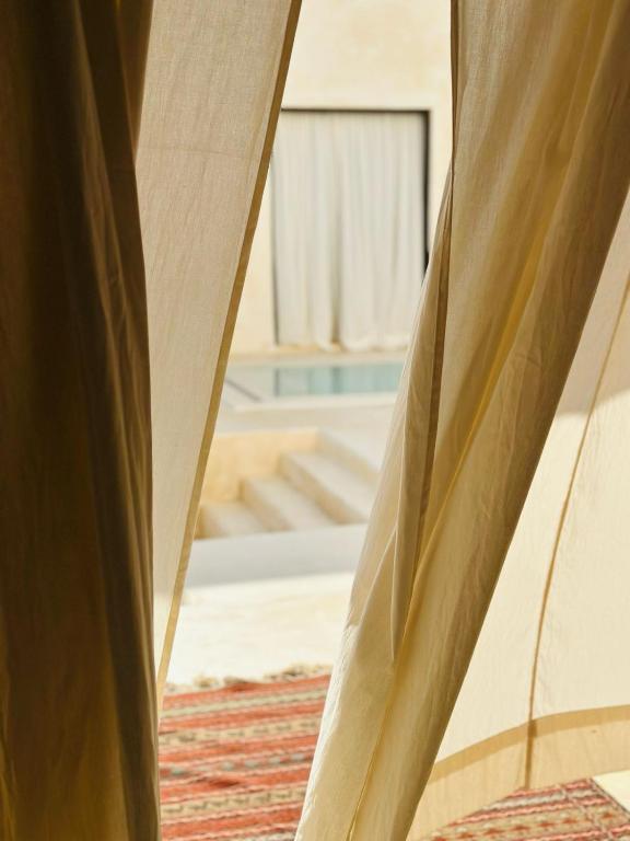 Postel nebo postele na pokoji v ubytování Tulia House Lamu