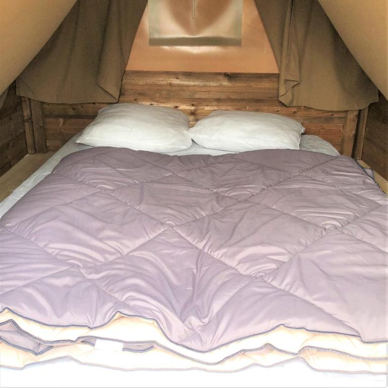 Postel nebo postele na pokoji v ubytování Camping Bois et Toilés