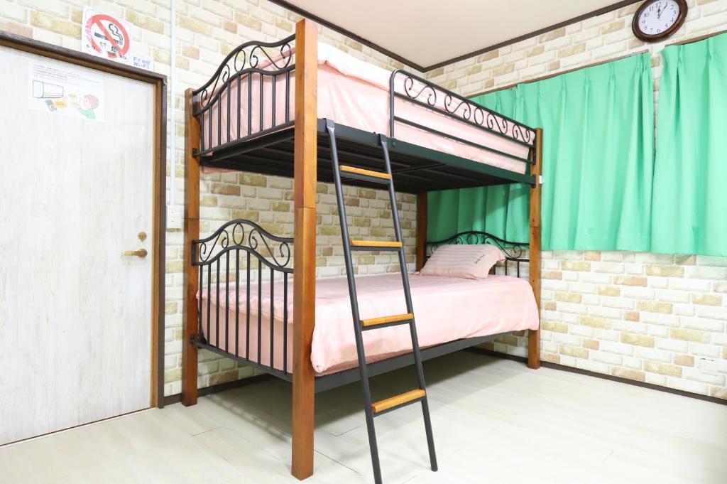 Postel nebo postele na pokoji v ubytování HILDA INN