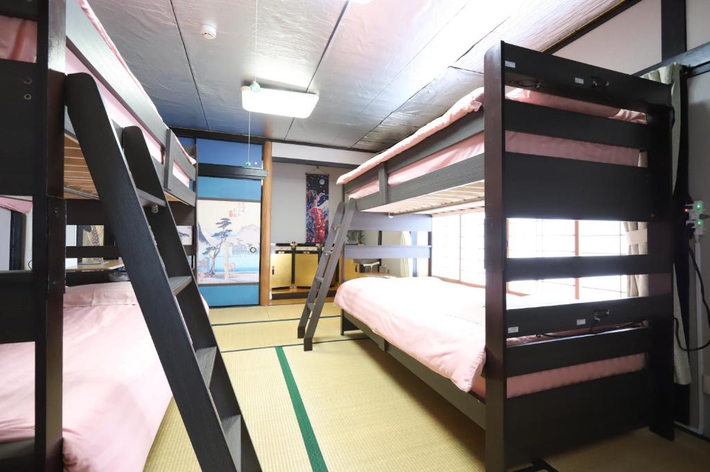 Postel nebo postele na pokoji v ubytování HILDA INN