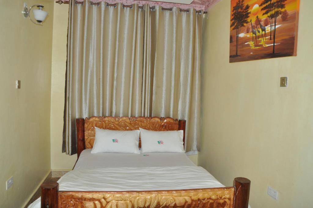 Un pat sau paturi într-o cameră la Trinity Resort Hotel & Spa