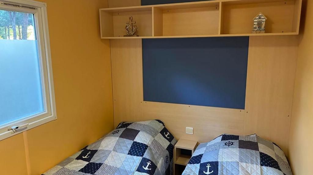 Postel nebo postele na pokoji v ubytování Mobil home Les Sables d'Or Agde