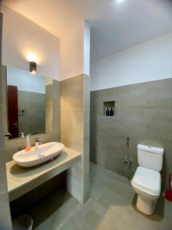 Koupelna v ubytování Reef Bungalow Hotel