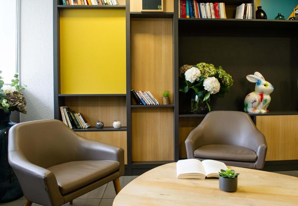 Posezení v ubytování B&B HOTEL Saint-Quentin