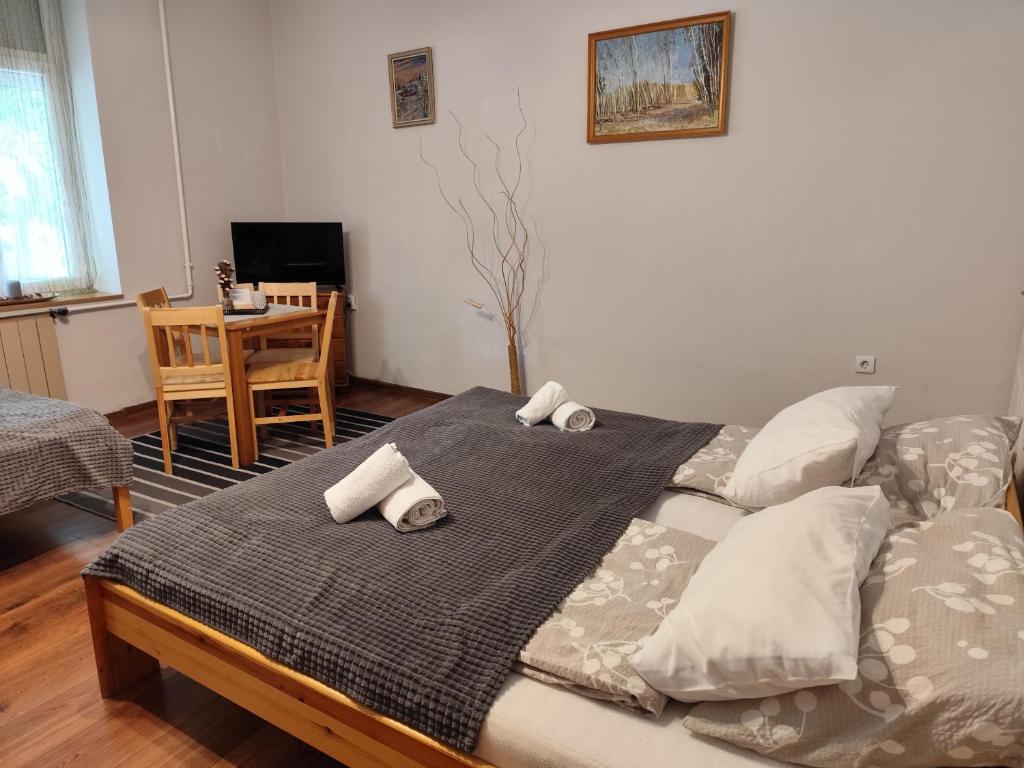 Postel nebo postele na pokoji v ubytování Bazilika Vendégház