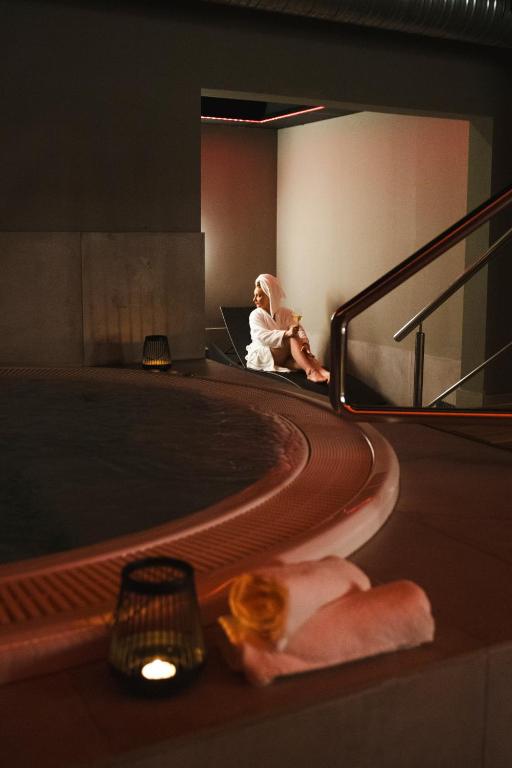 Guest relaxing in the hotel spa at Hótel Vesturland