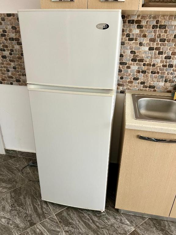 Kuchyň nebo kuchyňský kout v ubytování Shengjin Apartments