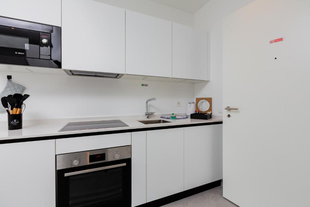 Kuchyň nebo kuchyňský kout v ubytování Campus Lugano {30 wonderful Smart Suites} in the university area