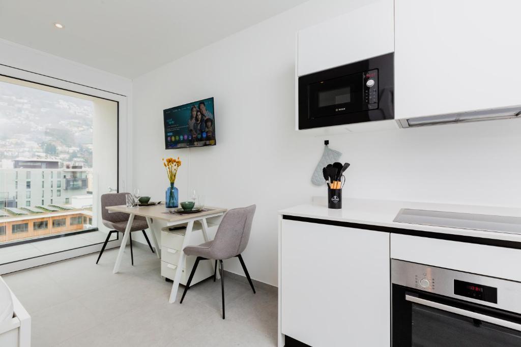Kuchyň nebo kuchyňský kout v ubytování Campus Lugano {30 wonderful Smart Suites} in the university area