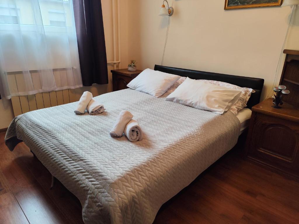 Postel nebo postele na pokoji v ubytování Bazilika Vendégház