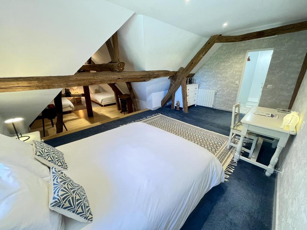 Postel nebo postele na pokoji v ubytování Le Clos des Châteaux