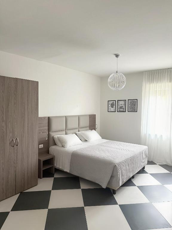 Postel nebo postele na pokoji v ubytování Cà Masawalsa Hotel
