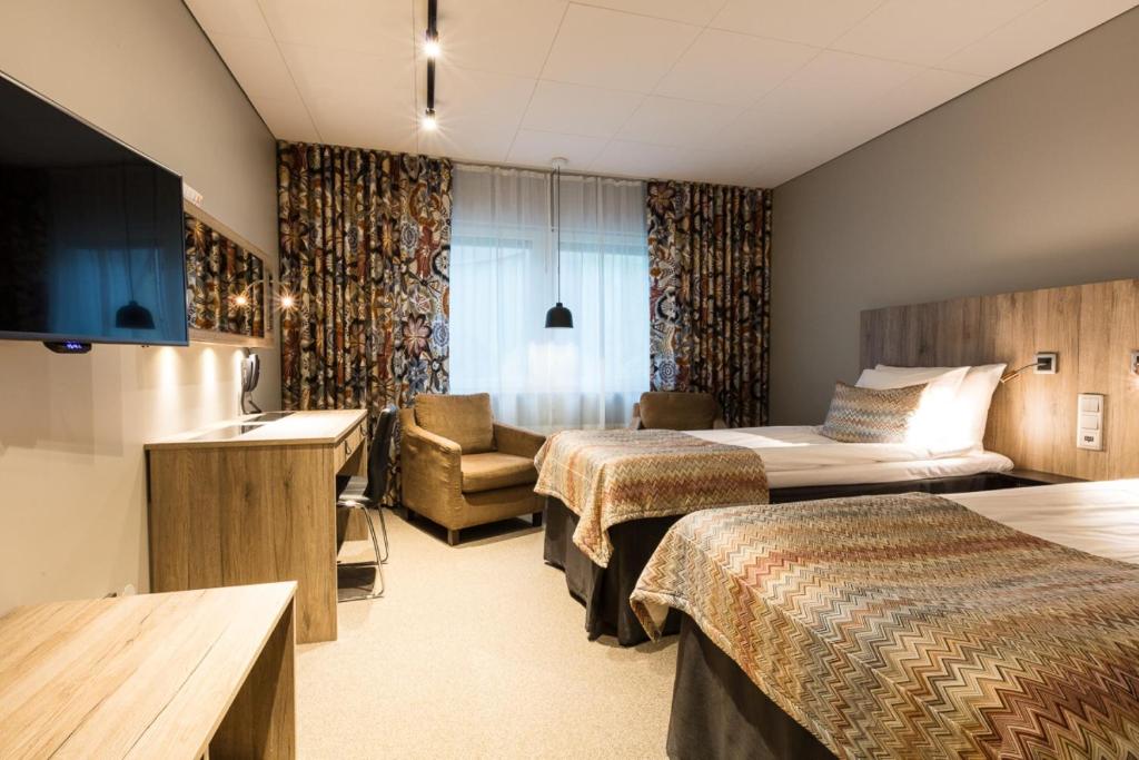 Postel nebo postele na pokoji v ubytování Best Western Plus John Bauer Hotel