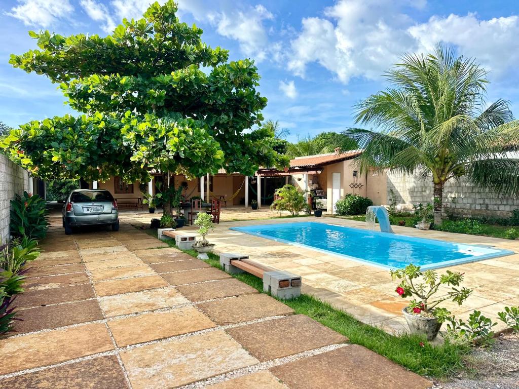 a swimming pool in the backyard of a house at Casa com Piscina Privativa na Lagoa do Paraíso - John House Paradise in Jijoca de Jericoacoara