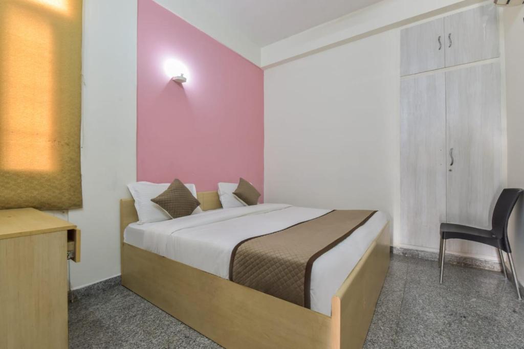 Postel nebo postele na pokoji v ubytování The Hotel Madhavam