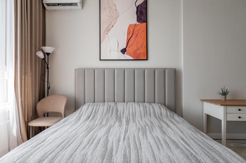 Ένα ή περισσότερα κρεβάτια σε δωμάτιο στο EXPO UNION Apartments