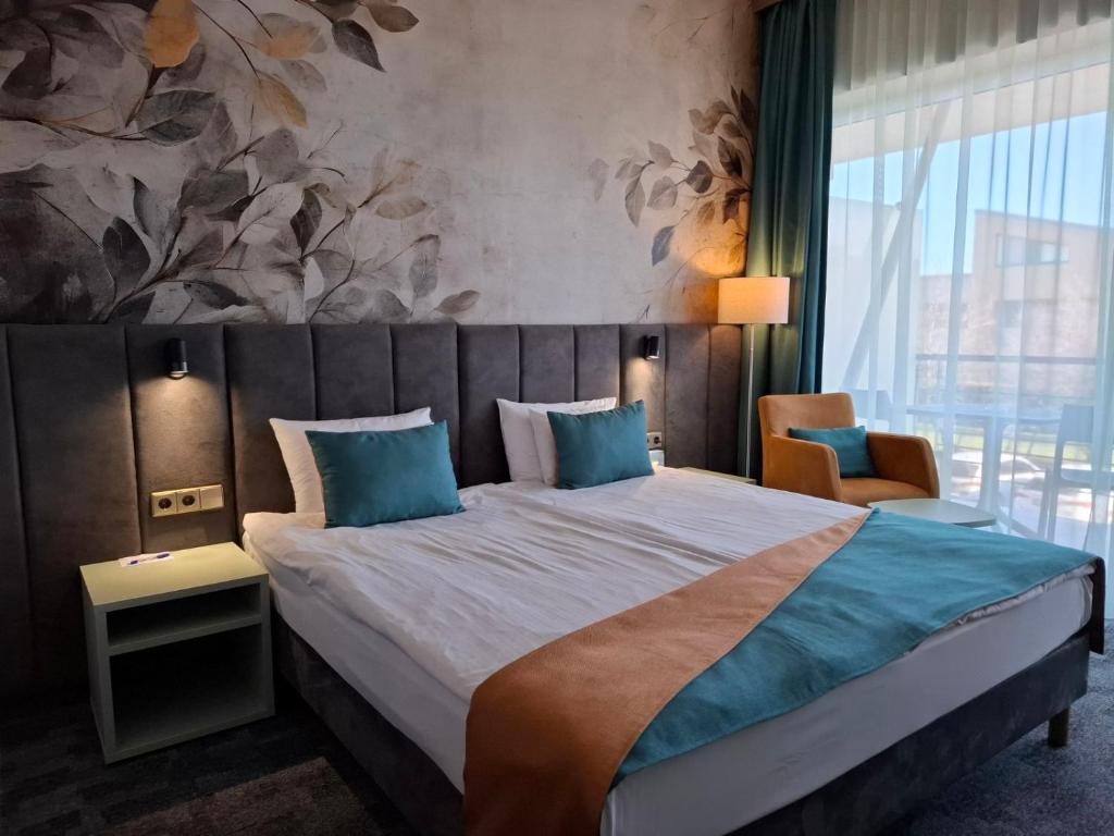Postel nebo postele na pokoji v ubytování Szépia Bio and Art Hotel
