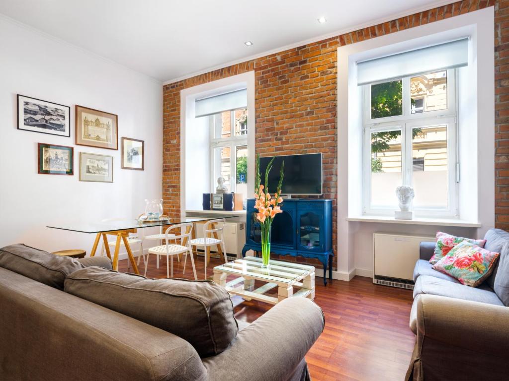 Televízia a/alebo spoločenská miestnosť v ubytovaní Tyzenhauz Apartments Comfort