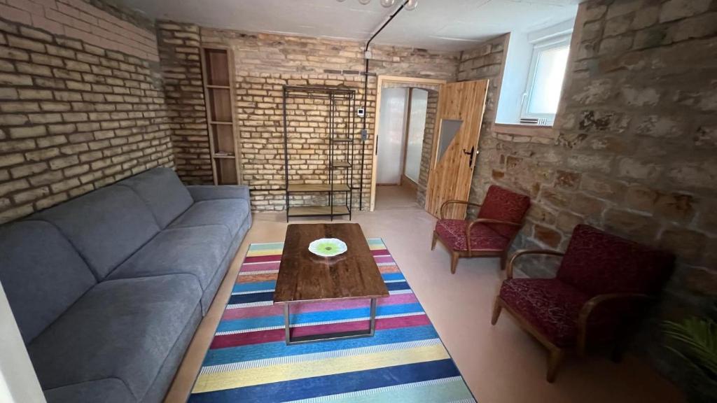 a living room with a couch and a coffee table at Villa Mediterrane - Apartment Bologne in Frankenthal