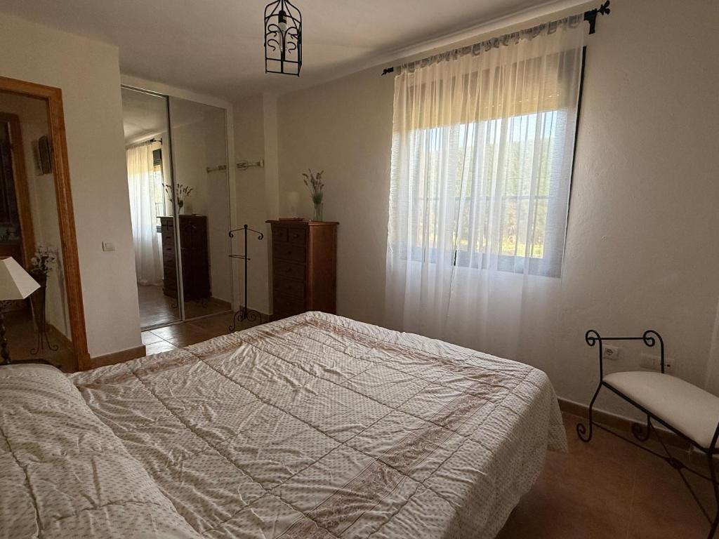 Postel nebo postele na pokoji v ubytování Apartamentos Vacacionales Atlanterra