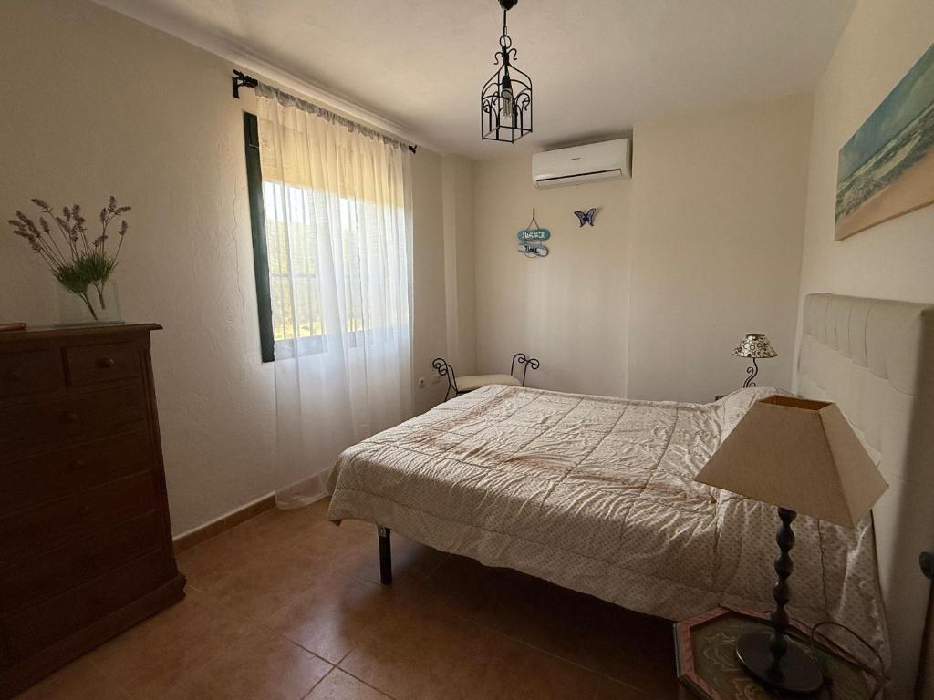Postel nebo postele na pokoji v ubytování Apartamentos Vacacionales Atlanterra