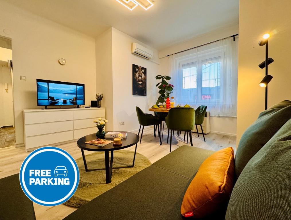 a living room with a couch and a table at CityLink Nest Budapest - Free garage, AC & metro access in Budapest