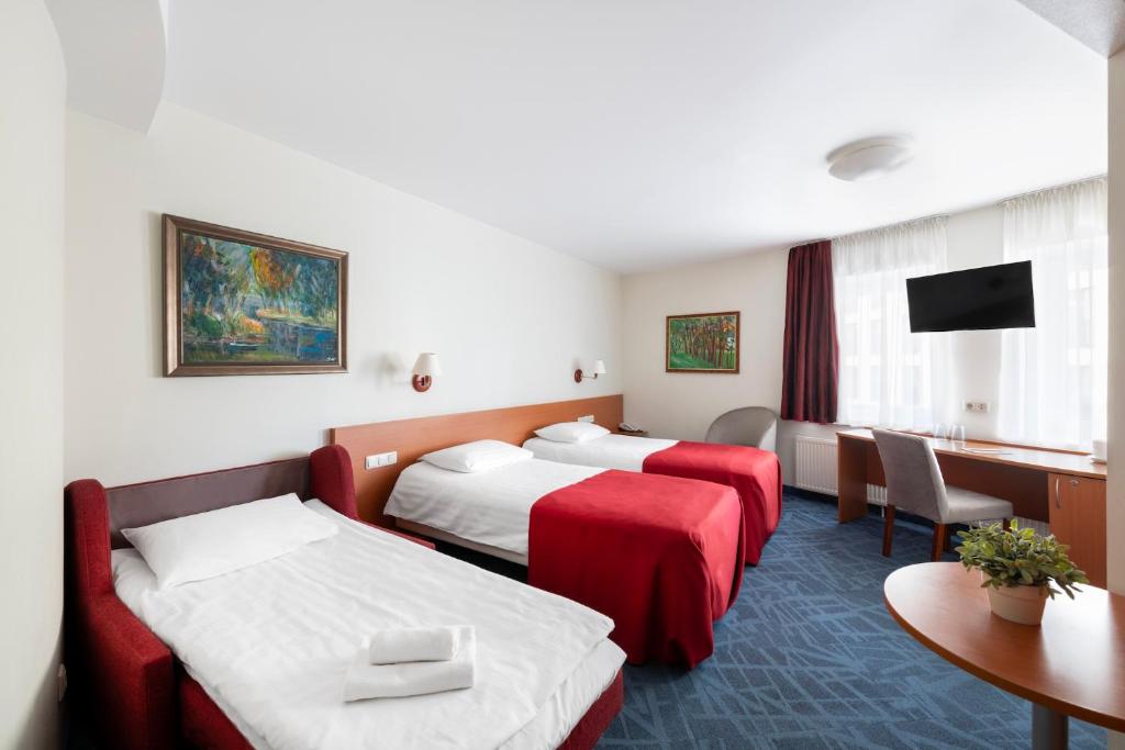Postel nebo postele na pokoji v ubytování Art City Inn