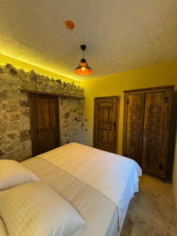 Postel nebo postele na pokoji v ubytování Wanderlust Inn Cappadocia