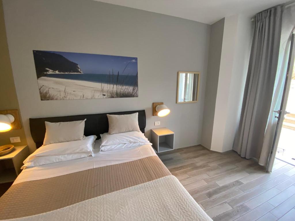 Postel nebo postele na pokoji v ubytování B&B 125Metri sul mare