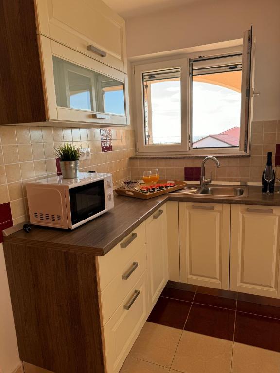 Kuchyň nebo kuchyňský kout v ubytování Apartmani "Bodulo"
