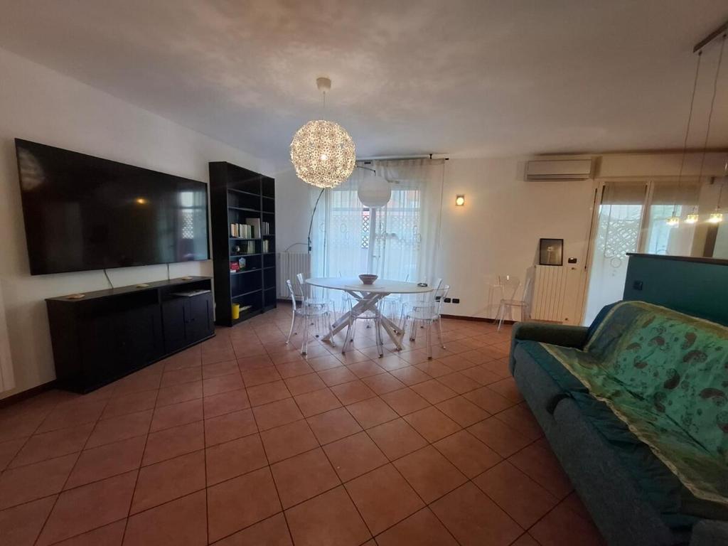 a living room with a couch and a table at B&B Casa Fortunata in Milan