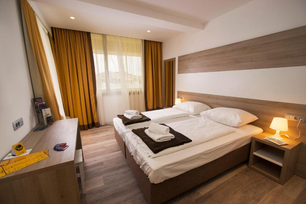 Postel nebo postele na pokoji v ubytování Hostel Sol