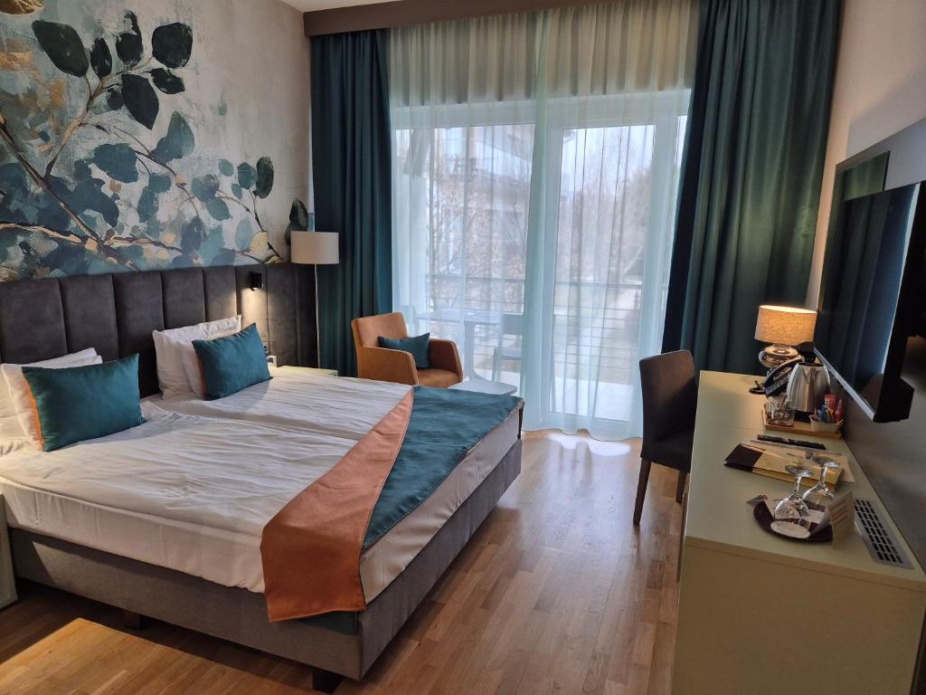 Postel nebo postele na pokoji v ubytování Szépia Bio and Art Hotel