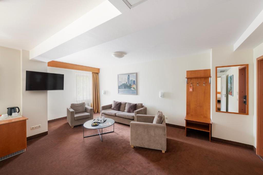 TV a/nebo společenská místnost v ubytování Art City Inn
