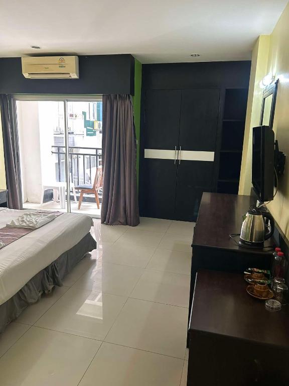 Postel nebo postele na pokoji v ubytování Star House Patong