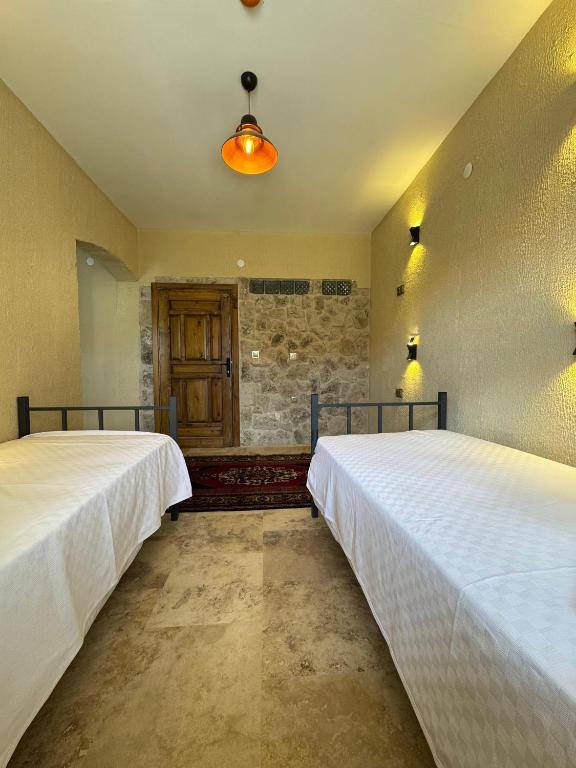 Postel nebo postele na pokoji v ubytování Wanderlust Inn Cappadocia