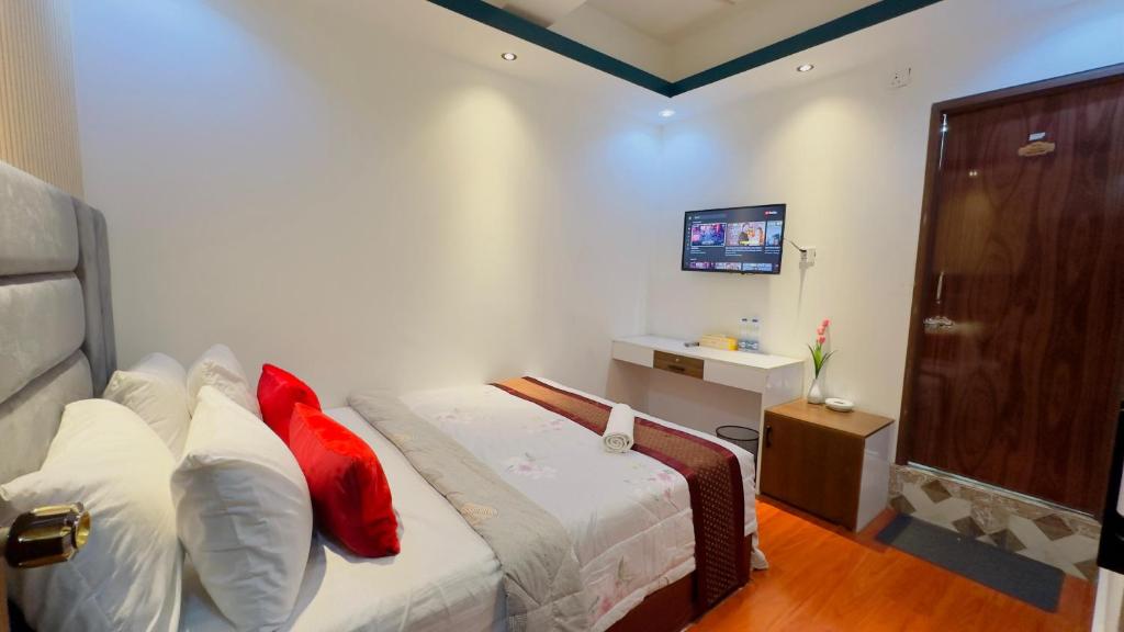 Postel nebo postele na pokoji v ubytování Rezala Sweet Home Uttara