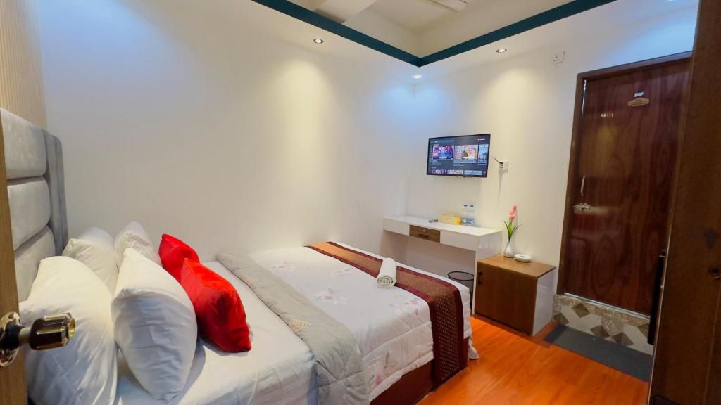 Postel nebo postele na pokoji v ubytování Rezala Sweet Home Uttara