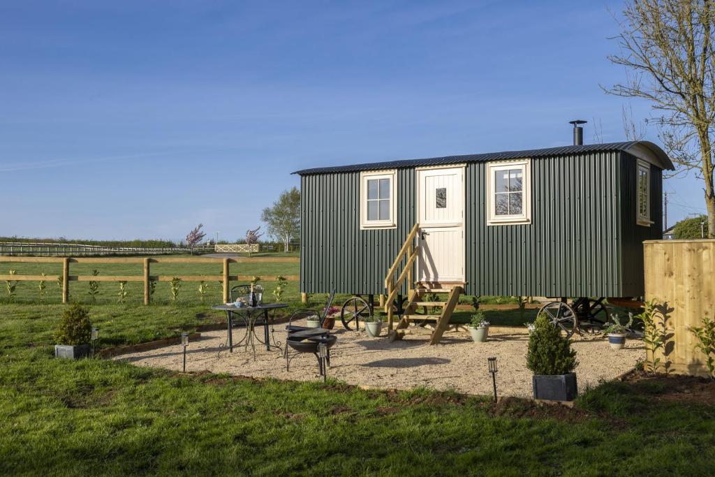 a tiny house on display in a field at The Cotswold Nest in Moreton in Marsh