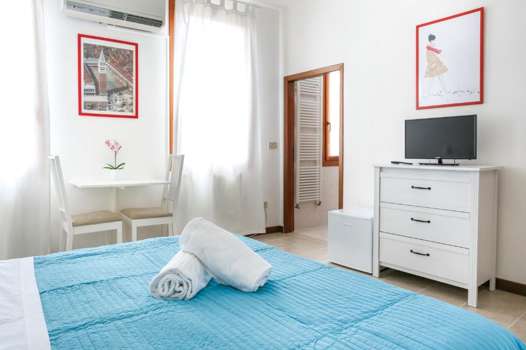 Posteľ alebo postele v izbe v ubytovaní Inlaguna