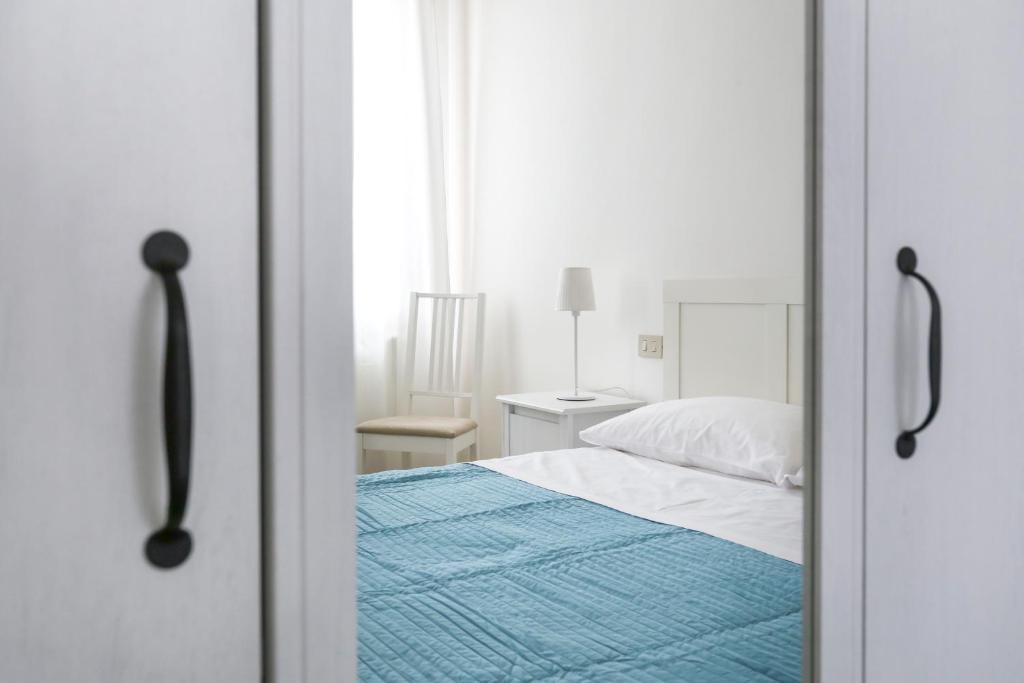 Posteľ alebo postele v izbe v ubytovaní Inlaguna