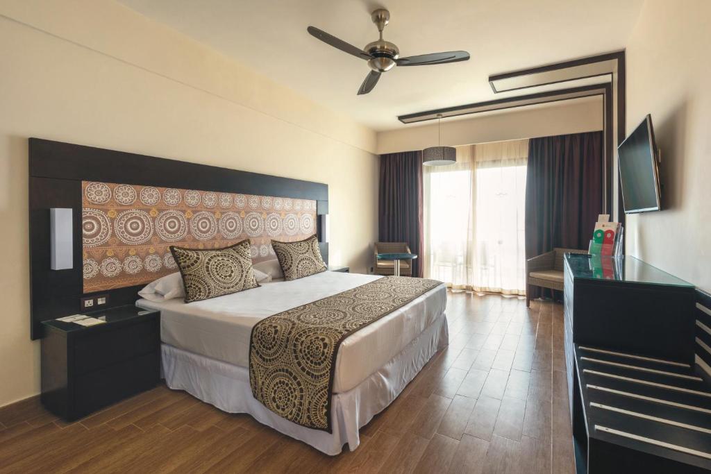 Postel nebo postele na pokoji v ubytování Riu Sri Lanka All Inclusive