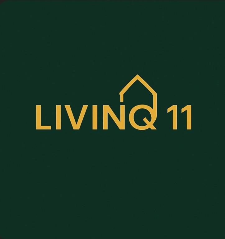 a sign that reads living with a house at LlVINQ 11 in Emstek