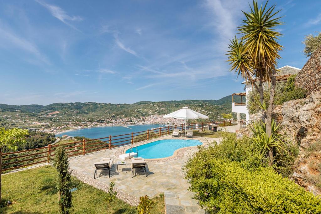 a villa with a swimming pool and a view at Kohili Villas - Sea View Residences in Skopelos Town