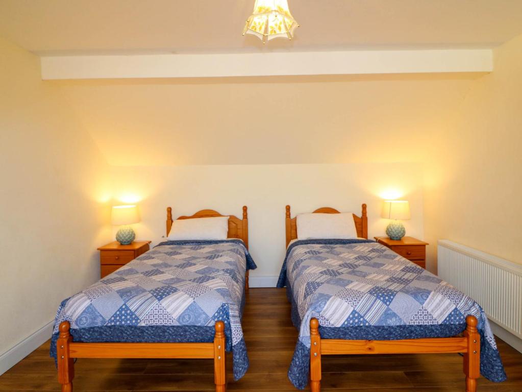 Postel nebo postele na pokoji v ubytování Curraha