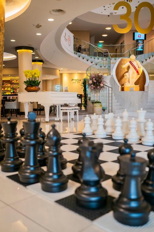 a large chess board with a giant chessintend at Don Giovanni Hotel Prague - Great Hotels of The World in Prague