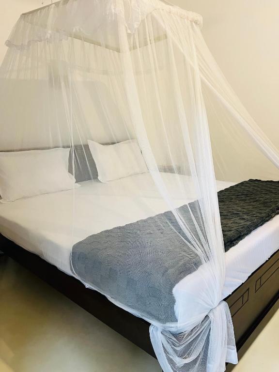 Postel nebo postele na pokoji v ubytování Bloom Bay
